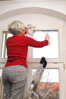 Cleaning flat windows, Germany, Europe