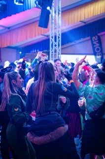 Dancing people enjoying a party with colourful lights in a tent, carnival, Schlagerkuchen Donzdorf,