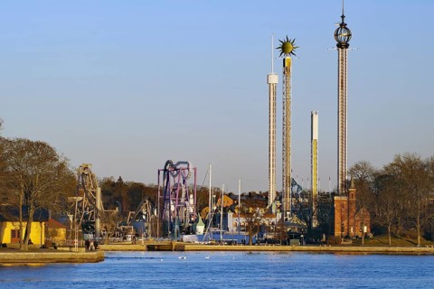 Amusement park with various rides under a clear sky, Djurgarden, Stockholm, Sweden, Europe