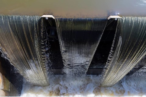 Water flows through the Spree weir of the Hauptspree in Uhyst, Boxberg, Upper Lusatia, Saxony,