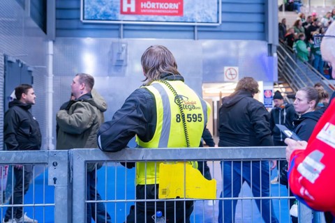 A member of the security service observes an event in an arena, Heilbronner Falken Vs Bietigheimer