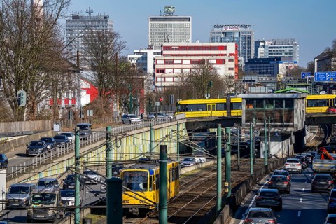 Motorway A40, Ruhr expressway, heavy traffic jam, rush hour, city passage in Essen, skyline of the