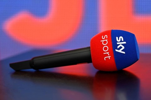 Close-up, microphone, mike, SKY, logo, background blue orange, lying on table, reflection,