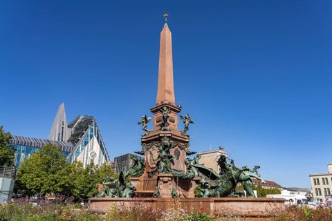 The Mende Fountain and the modern Augusteum of the University of Leipzig on Augustusplatz, Leipzig,