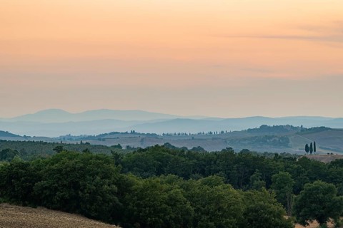 Tuscan landscape with fields and hills at sunset, Unesco world heritage, Pienza, Val d'Orcia,