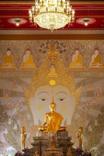 Golden Buddha statue with tunic, Bhumispara-mudra, Buddha Gautama at the moment of enlightenment,
