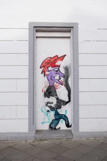 Graffiti on a disused entrance door, street photography, Linden-Limmer, Hanover, Lower Saxony,