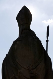 Statue of Bishop Boniface with mitre and crozier against the light, Freckenhorst, Münsterland,