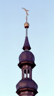 Schweinfurt, St Salvator. Trumpet blowing angel as weather vane on the baroque spire, St., Sankt,