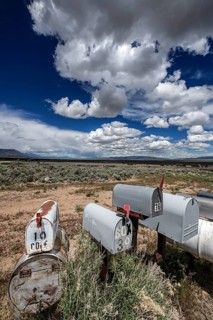 Letterboxes, mailboxes, cumulus clouds Highway 50, Loneliest Road in America, Ely, Nevada, USA,