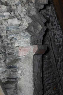 Above the choir vault, wall above the choir arch, remnant of a Romanesque window Church of St.,