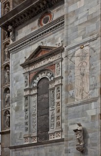 Italy Como Cathedral Gilded blind window on the south side of the west building c. 1500 accompanied