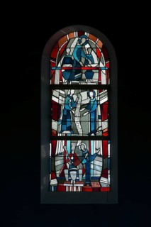 Stained glass window by Ernst Jansen-Winkeln in the left (eastern) aisle, scenes from the life of