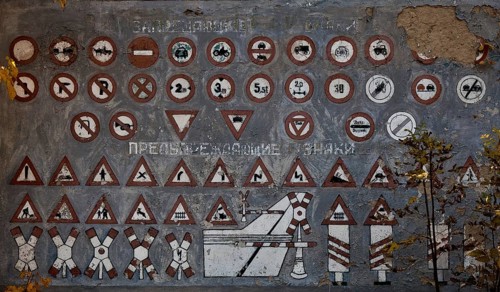 Wall painting with traffic signs to inform military drivers
