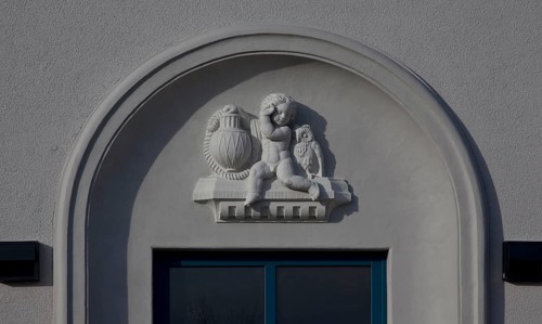 Built in 1913, IBA project 2010, exterior ornamentation, putto with lamp and owl