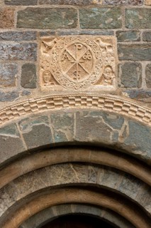 Coll, Santa Maria de l'Assumpció, west portal with Christ's monogram