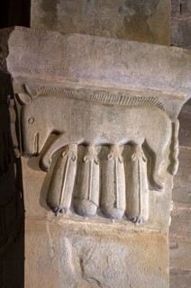 Gropina, Pieve San Pietro di Gropina, capital next to the west portal: pig suckling piglet