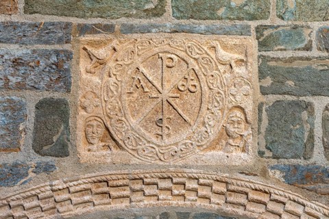 Coll, Santa Maria de l'Assumpció, west portal with Christ's monogram
