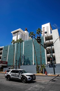 Marshal patrols in front of Art Deco façade, car park of Binions Casino Hotel, Downtown, Las Vegas,