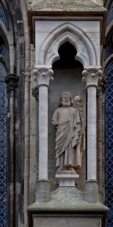 Sculpture of a king in the right buttress canopy on the north side of the three western nave bays,