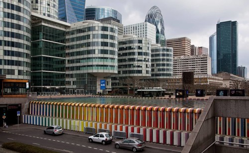 Water basin, in front of it cascading overflow made of coloured ceramic