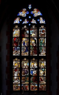 Renaissance window from 1535 on the end wall of the north aisle: Three Magi, with the founder