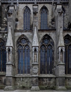 North façade of the three western nave bays with buttressed canopies restored in 2011, St., Sankt,