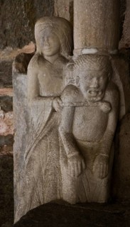 Collegiate church, south portal, woman ties up devil with chain, St., Saint, Saint