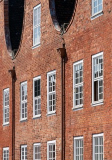 Built 1734-1742 for Dutch craftsmen, gable and façade detail with scroll, downpipe and windows