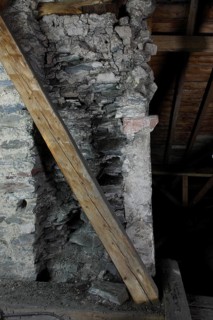 Above the choir vault, wall above the choir arch, remnant of a Romanesque window Church of St.,