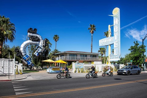 Cyclist in front of truck artwork, Fergusons Motel, Las Vegas, Nevada, USA, North America