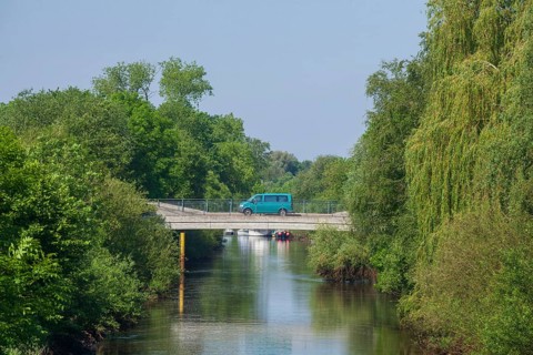 Road bridge with delivery van over the river Wümme in spring, Lower Saxony, Germany, Europe