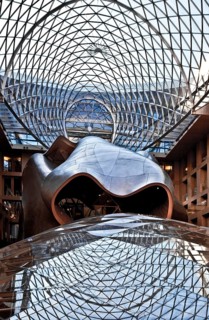 1996-2001 by Frank O Gehry, atrium with conference hall and arched sculpture
