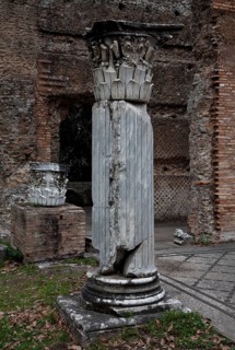 Column fragment in front of the triclinium