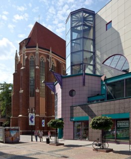 View from the north-east, in front of it the corner tower of the SOLPOL department stores', built