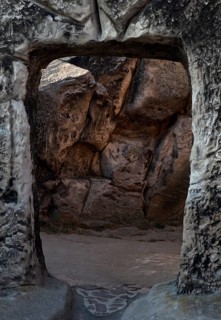 Artificial cave rooms, portal chiselled out of the bedrock