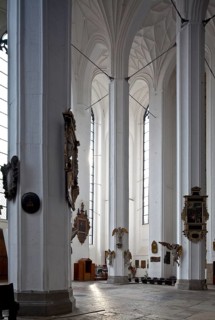 South transept from the north-east with epitaphs and other furnishings under the vault Tie rod, St