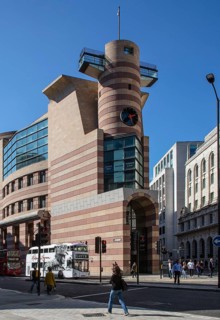 London, Queen Victoria Street. Postmodern head-end building on Queen Victoria Street designed by