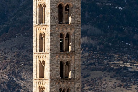 Taüll, Sant Climent, bell tower against the mountain backdrop