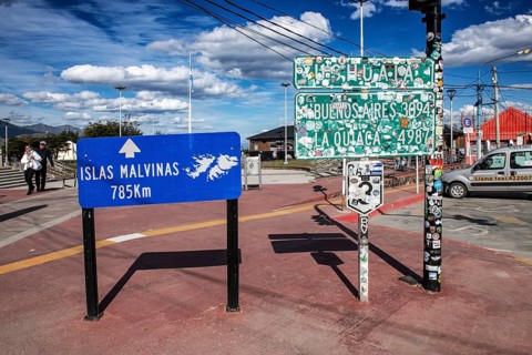 Town sign Ushuaia and distance sign to the Falkland Islands, Argentina, South America