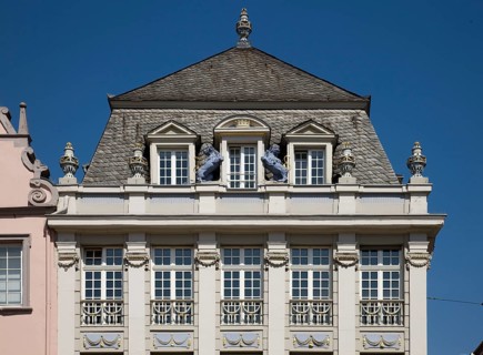 Three-storey corner residential and commercial building with Louis Seize façade, neoclassical