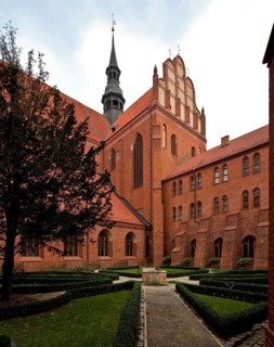 Former Cistercian church, cloister courtyard with a view of the south transept from the south-west,