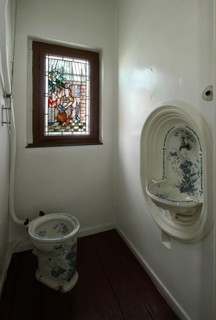 Manufacturer's villa, toilet halfway up the stairs, stained glass window with blacksmith depiction