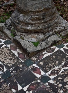 Column base on mosaic floor