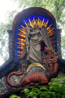 Redemption Garden, chapel with the theme of redemption from evil, pediment with the apocalyptic sun