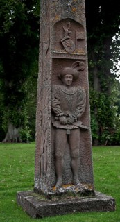 Obelisk with high relief of the sitter in elegant traditional costume, coat of arms and Scottish