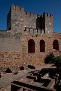 Alcazaba fortress, inner courtyard with Torre Quebrado, building floor plans exposed below