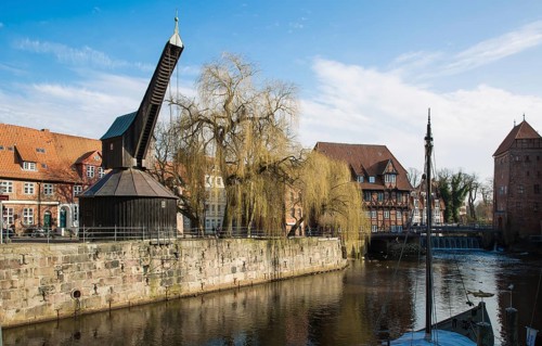 Lüneburg Old Crane 93429 built in 1797 with inner treadwheel on the banks of the Ilmenau in