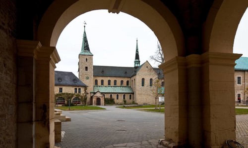 Monastery church seen from the south through the gatehouse, St., Sankt, Saint
