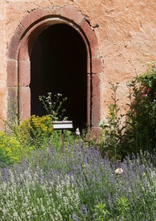 Former infirmary behind the abbot's house, entrance, in front the herb garden